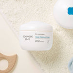 GOONGBE Pri-immune Deep Moisture Cream jar on a textured beige background