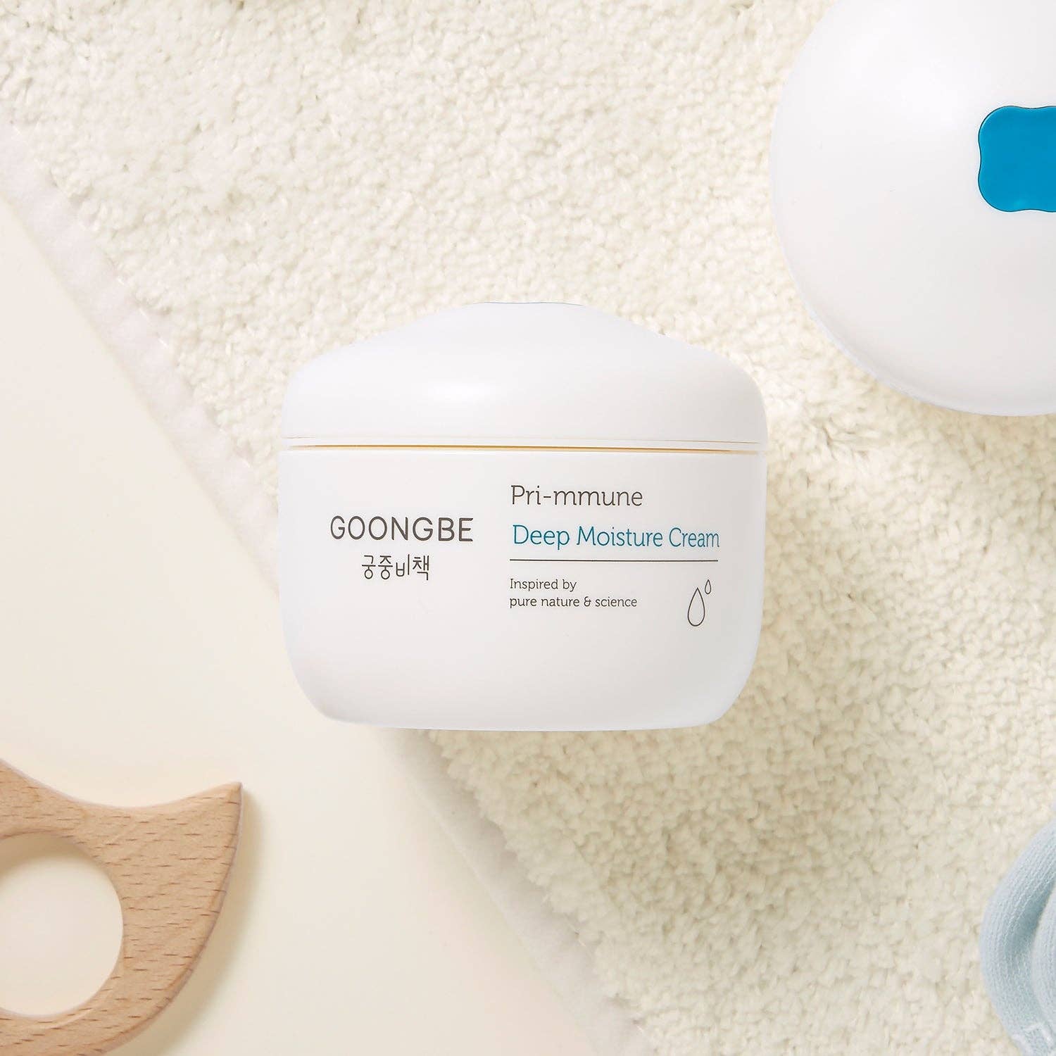 GOONGBE Pri-immune Deep Moisture Cream jar on a textured beige background