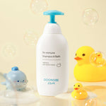 GOONGBE shampoo and bath bottle with rubber ducks on a light yellow background